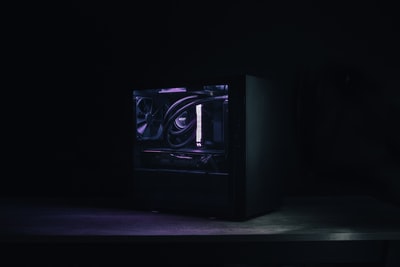 Black black and silver speakers on the table
